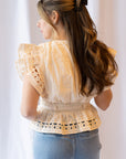 Noemi Eyelet Trim Peplum Top
